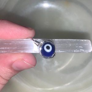 Silver wire-wrapped evil eye ring